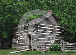 Small log cabin in the trees.