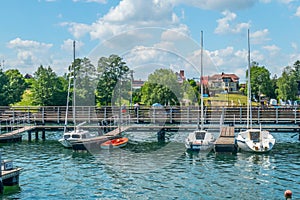 Small marina for sailboats with lake landscape in summer