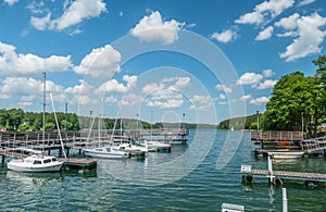 Small marina for sailboats with lake landscape in summer