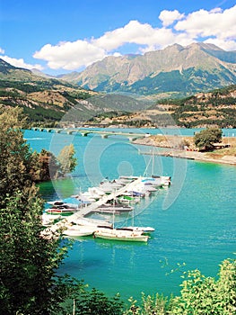 The small marina of Savines-le-Lac in the Alps in France.