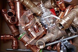 Small material for plumbers and heating installers. Copper, brass, steel, pipes, angles.