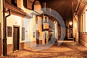 Small medieval houses in Golden Lane by night, Prague Castle, Czech Republic