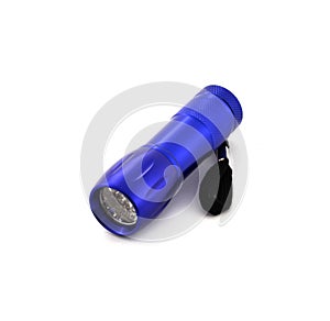 Small metal led flashlight in blue color on white background