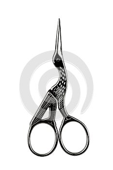 small metal nail scissors in the shape of a stork, isolated