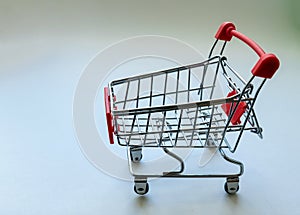 Small metal toy grocery cart from a supermarket