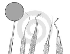 small Mirror and dental tool to remove tartar in the dental clin photo