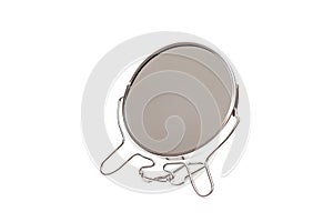 Small mirror in metal frame on a white background