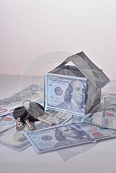 Small Model House and Keys on Newly Designed U.S. One Hundred Dollar Bills