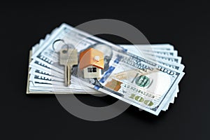 Small Model House and Keys on Newly Designed U.S. One Hundred Dollar Bills. The keys to the purchased house. Reduced copy of the