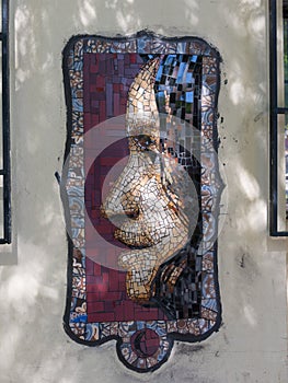 Small mosaic on a street in the neighborhood of Miraflores, in homage to the singer Violeta Parra. Santiago, Chile photo