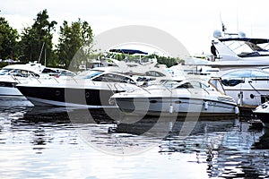 Small motor boat at anchor by rope in Replot pier