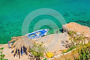 Small motorbat docked in peaceful bay photo