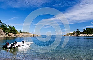 Small motorboat at anchor