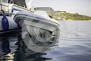 Small motorboat at the dock with beautiful reflections in the water