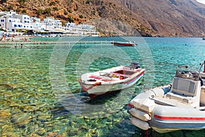 Small motorboats at clear water bay of Loutro town on Crete island, Greece