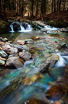 Small mountain stream in spring on Mount Pinacle, Quebec, Canada