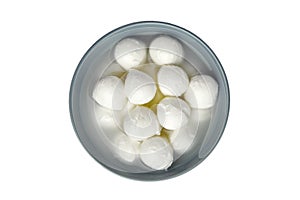 Small mozzarella cheese balls in ceramic bowl isolated on white background