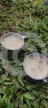 Small Mug of Coffee on Grass