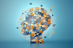Small multi-colored jigsaw puzzle pieces shaped as human head on light blue background