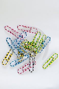 A small, multi-colored paper clip