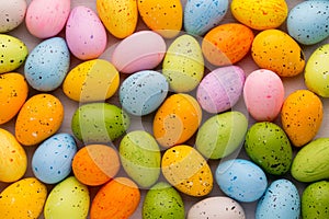 Small multicolored Easter eggs. Spring background.