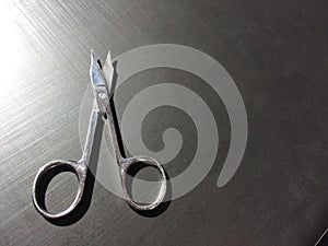 Small nail scissors on a dark background