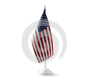 Small national flag of the United States on a white background