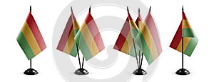 Small national flags of the Bolivia on a white background