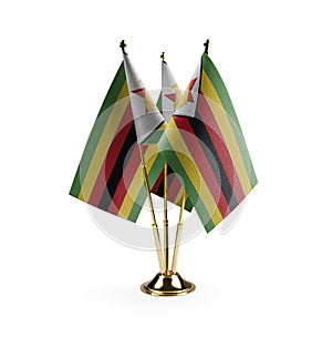 Small national flags of the Zimbabwe on a white background