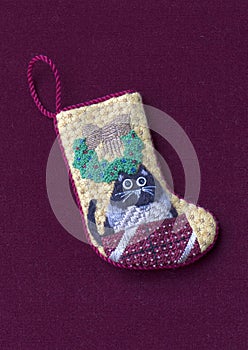 Small needlepoint Christmas stocking with cat