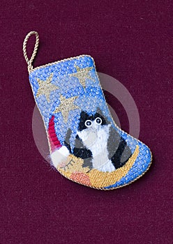 Small needlepoint Christmas stocking with cat