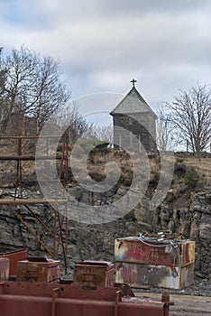 A small Norwegian Chapel overlooks a Shipyard and Industrial Setting in Maloy in Norway on a cold winters morning photo