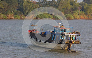 An Small, Old Cargo Ship Along the Mekong