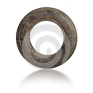 Small old dirty tire isolated