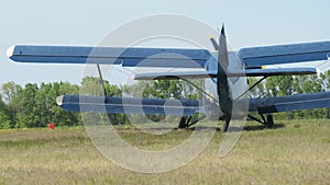 Small Old Propeller Plane is Moving Towards the Runway in Field for Takeoff