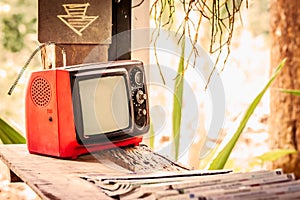 Small old television on wooden table