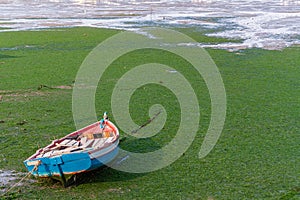 Small, old traditional boat in Arrentela, Seixal bay