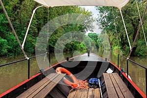 Small old vintage boat on a peaceful small river