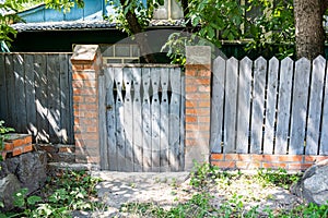 Small old wooden gates near residential homes