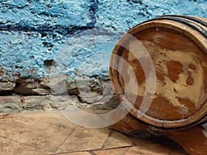 Small old wooden wine barrel on a wooden stand.