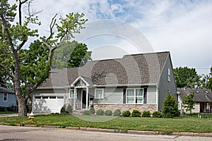 Small One-Story House with Large Tree