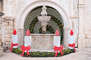 Small Onofrio Fountain decorated with Advent wreaths and candles in Dubrovnik