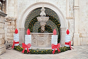 Small Onofrio Fountain decorated with Advent wreaths and candles in Dubrovnik