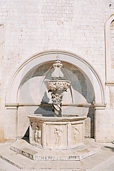 Small Onofrio Fountain near an ancient building. Dubrovnik, Croatia