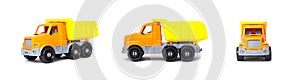 Small orange toy dump truck lorry on a white background, isolate