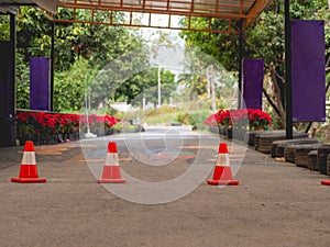 Small orange traffic cone   on road