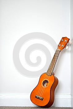 Small orange ukelele