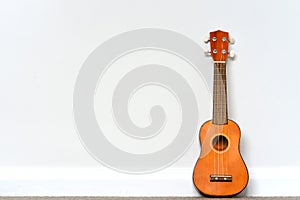 Small orange Ukelele