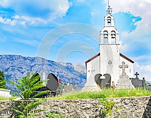 Small orthodox cemetery and church in the mountains of Montenegro on the way to the Ostrog Monastery