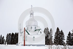 A small Orthodox Church in a winter landscape